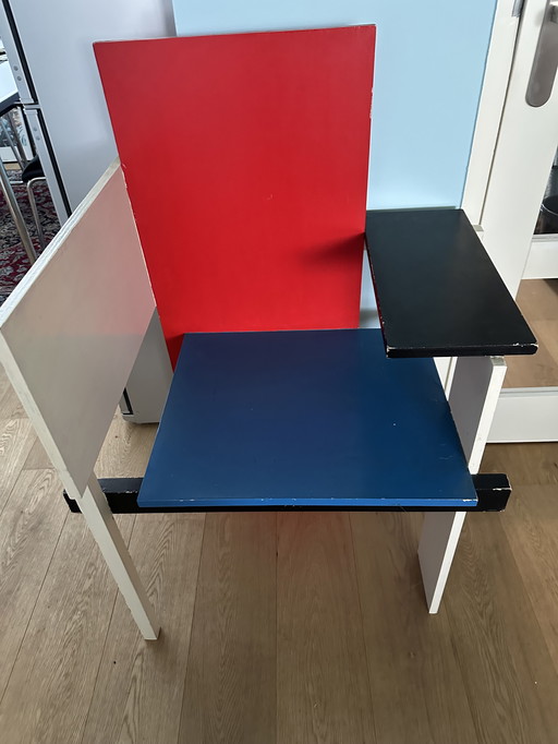 Red, blue white chair