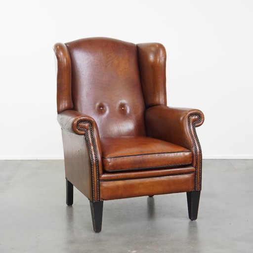 Grote vintage schapenleren oorfauteuil