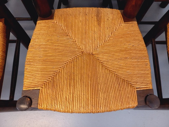 Image 1 of Set van 6 vintage brutalistische stoelen van Georges Robert, gemaakt van hout en stro, uit de jaren 50 en 60.
