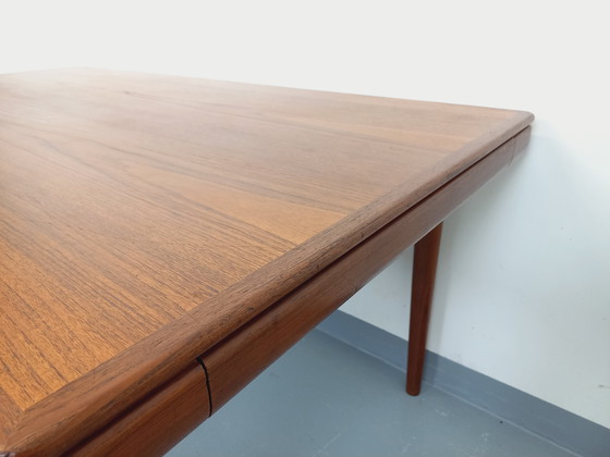 Image 1 of Scandinavian rectangular vintage dining table by Johannes Andersen for Samcom from the 60s in teak with integrated extensions