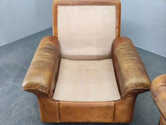 Image 1 of Een paar Arcon Italia loungefauteuils van cognacbruin buffelleer.