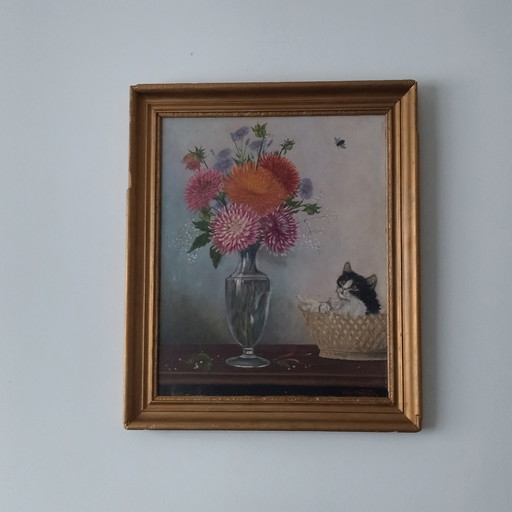 Antique painting of a kitten with a bouquet of flowers