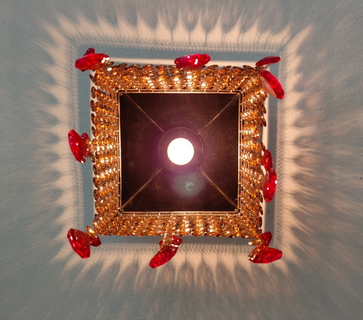 Richly decorated Ceiling light-chandelier with crystals and red pendants