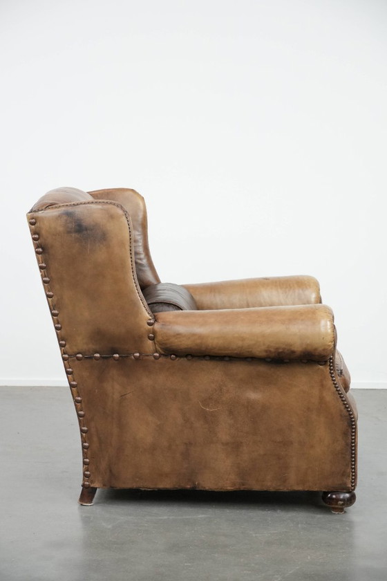 Image 1 of Ohrensessel im englischen Stil aus Kuhfell