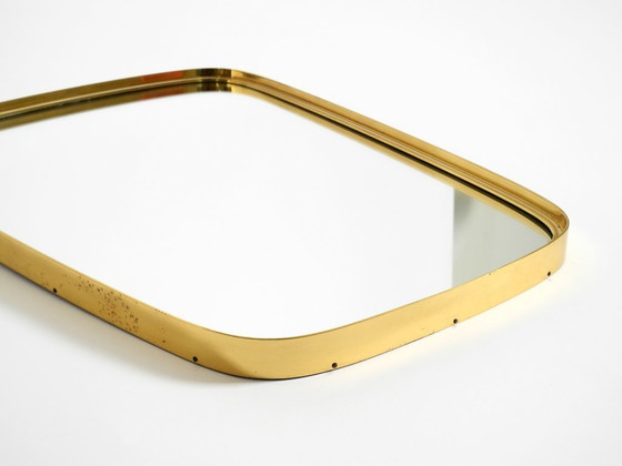 Image 1 of A pair of rare original Mid Century Modern "Münchener Zierspiegel" wall mirrors with heavy brass frames