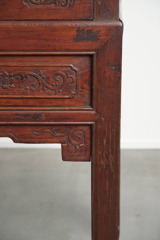 Image 1 of Antique wooden Chinese sideboard from the late 19th century in a beautiful red color with exquisite wood carving.