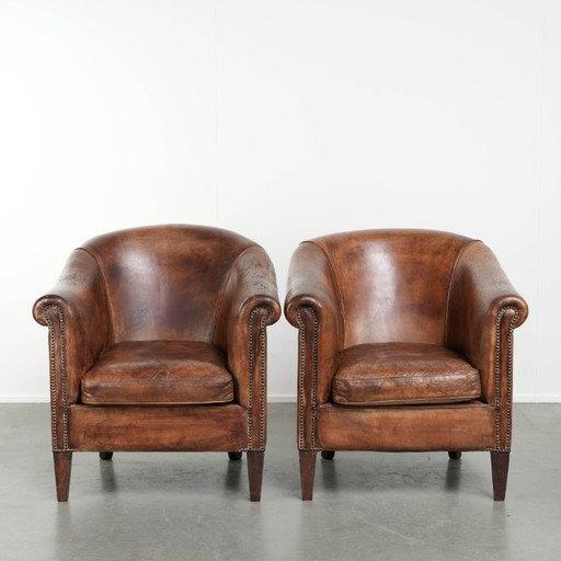Set di 2 robuste poltrone club vintage in pelle di pecora, dal look accattivante e dalla seduta confortevole.