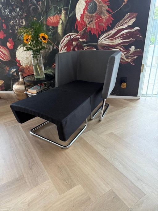 Designer chair with footstool