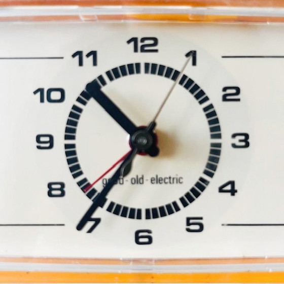 Image 1 of Vintage mid-century electric alarm clock Good-old-Electric plastic yellow 1970s