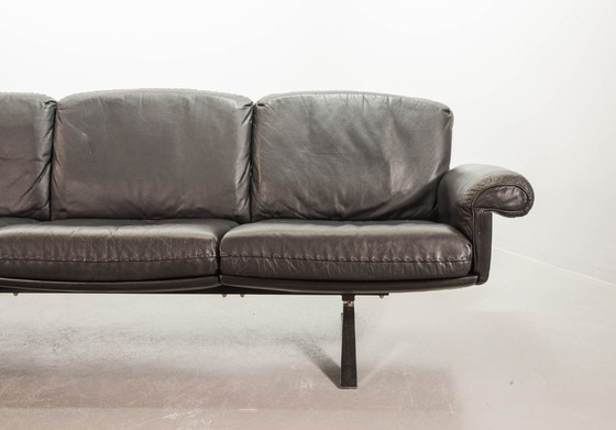 Image 1 of Exquisite Mid-Century Design De Sede Black Leather Strap Stitched Three-Seat Sofa DS31. Switzerland, 1960s.