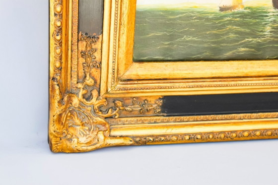 Image 1 of Tableau ancien représentant un navire en mer. Cadre baroque d'origine.