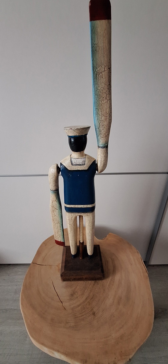 Image 1 of Antieke matroos met roeispanen als armen
