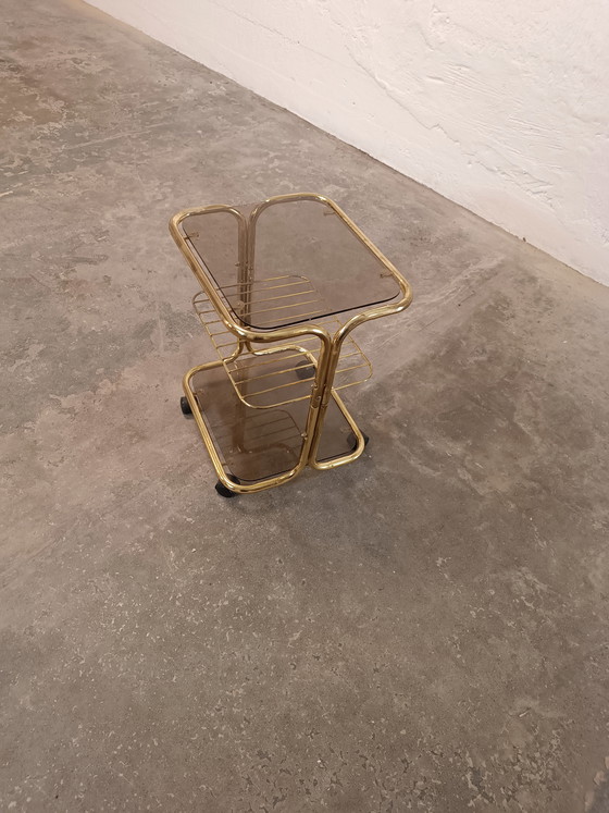 Image 1 of Vintage gold coloured and glass trolley side table 