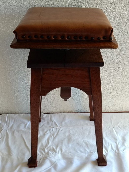 Antiker verstellbarer Klavierstuhl. Amsterdam Schule