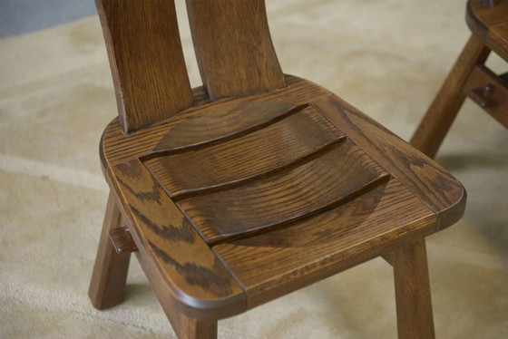 Brutalist pair of chairs by De Puydt in oak, 1960s. – Dining chairs (photo 3 of 9)