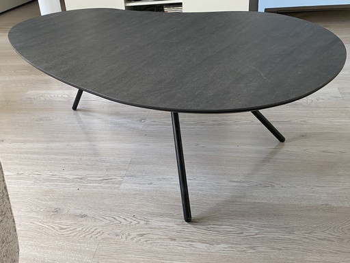 Hulshoff coffee table. Ceramic top with three metal legs. Kidney-shaped. Dimensions 76x120cm. As good as new.