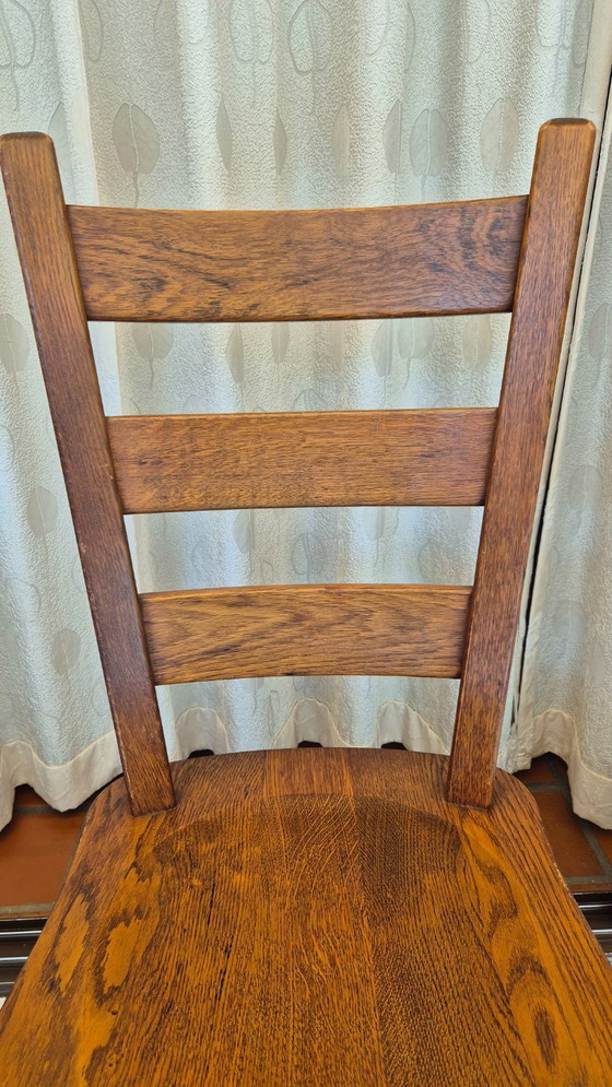 Image 1 of Set van 4 vintage Nederlandse brutalistische massief eikenhouten eetkamerstoelen – Nederlands vakmanschap