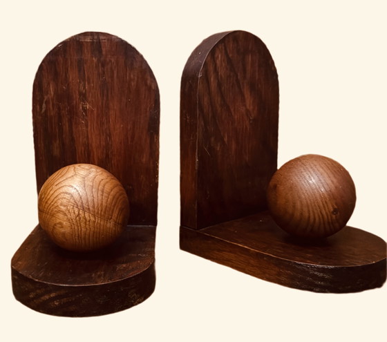 Image 1 of 2x Art Deco bookends. Left the paper in place and don't know if there is anything underneath.