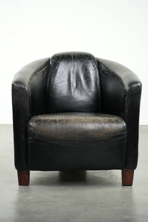 Zwarte vintage rundleren Aviator design fauteuil met een karaktervolle uitstraling