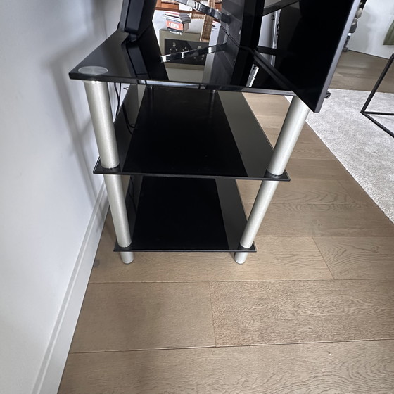 Image 1 of Black glass TV table