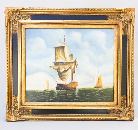 Image 1 of Tableau ancien représentant un navire en mer. Cadre baroque d'origine.