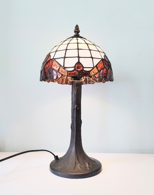 Tiffany style table lamp with stained glass shade and bronze base
