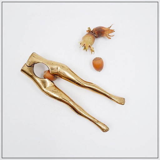Vintage brass nutcracker in the shape of a woman's legs, 1970s