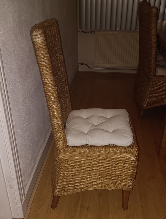 Image 1 of Tweedehands Eikenhouten eettafel en 6x Rotan stoelen 