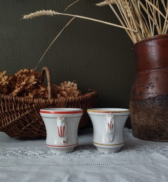 Image 1 of Een paar Sarreguemines ondoorzichtige porseleinen vuurkorfjes (1857-1900)