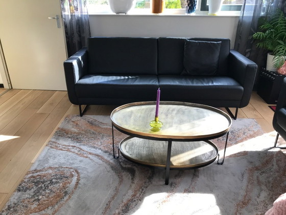 Image 1 of Divano e poltrona Montèl in pelle nera del 2023.