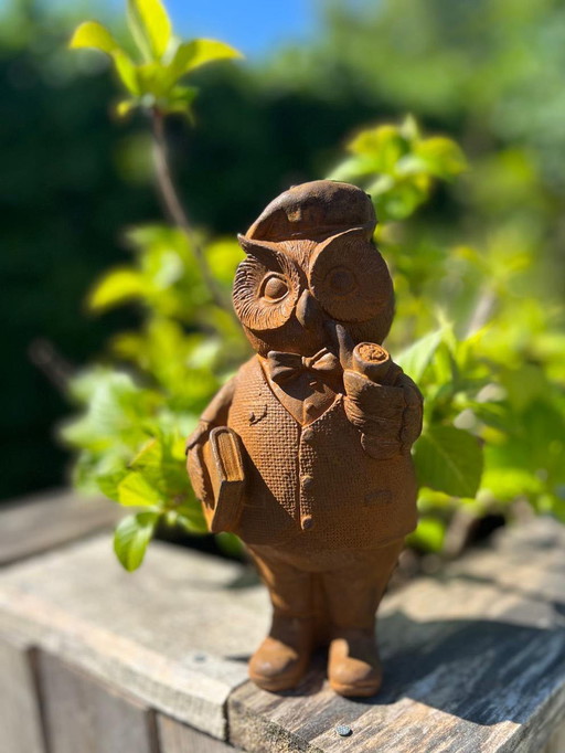 Cast iron owl with pipe and book