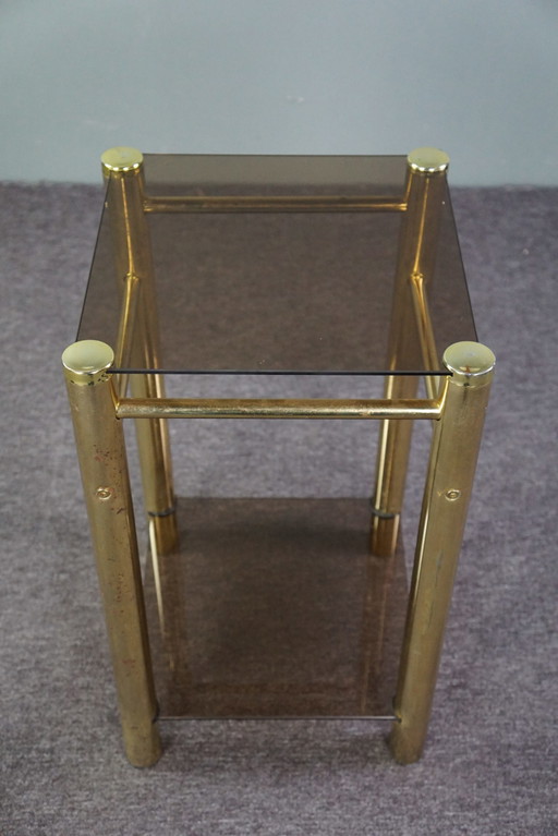 Gold Hollywood Regency smoked glass side table, column