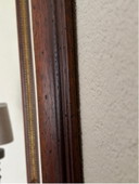 Specchio con cornice in legno pregiato e bordo sfaccettato lucido