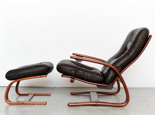 Scandinavian vintage armchair with ottoman by Arnt Lande for Westnofa, 1970s