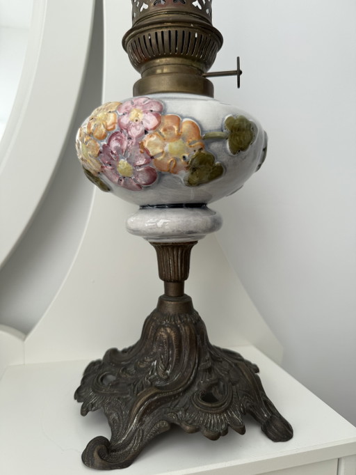 Antique kerosene lamp with ceramic floral decoration and P&A burner – ca. 1900