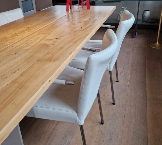 Image 1 of 4 dining room chairs upholstered in white leather
