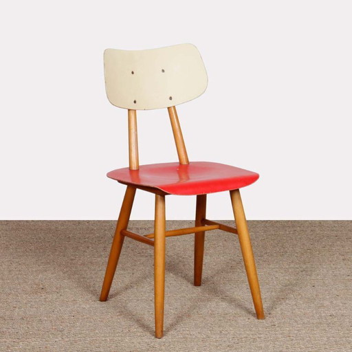 Red chair produced by Ton in the 1960s