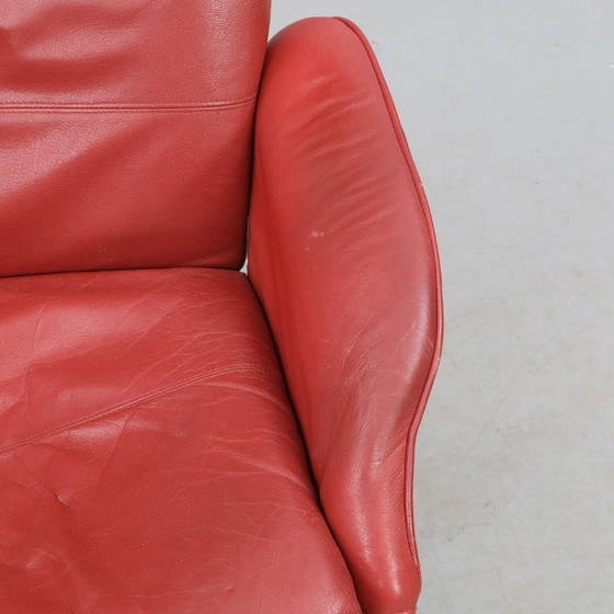 Image 1 of IKEA red leather armchair designed by K. Hagberg – M. Hagberg, from 2000–2010, with a tubular steel tripod base