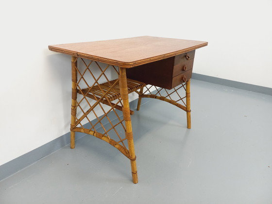 Image 1 of Vintage Louis Sognot bureau in rotan en hout uit de jaren 60