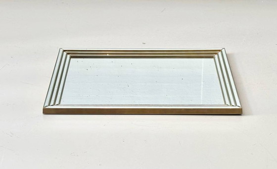 Image 1 of Wall mirror in a frame encased in beveled mirror glass