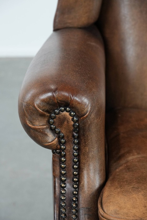 Image 1 of Comfortable vintage sheepskin wing chair with character