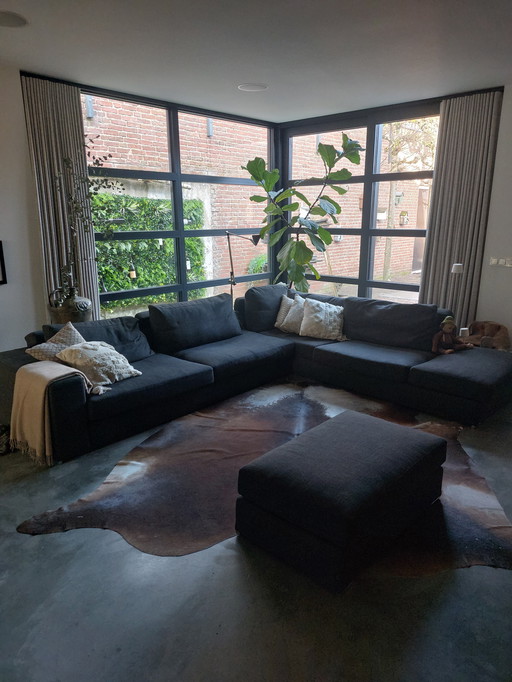 Divano angolare di design SIJBEN Anais con poggiapiedi