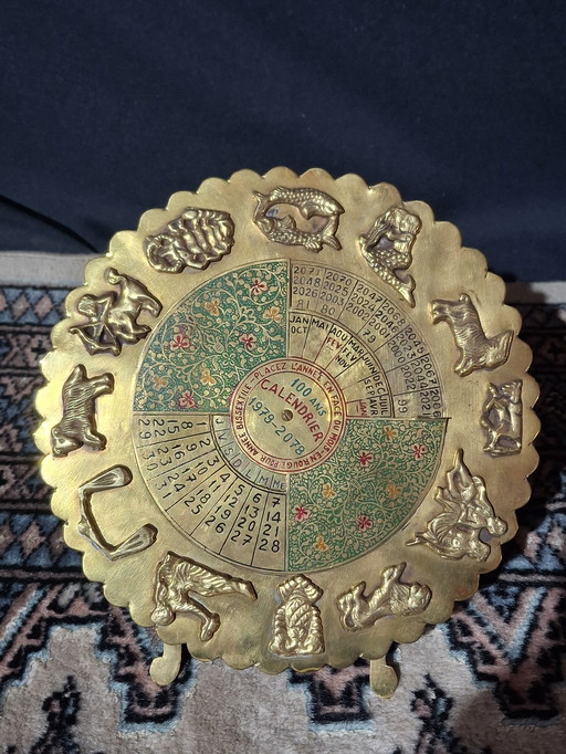 Perpetual calendar in gilded brass – Zodiac – 100 years (1978–2078)