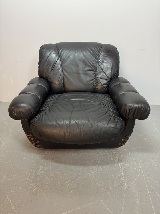 Image 1 of Beautiful Big Black Leather Postmodern Italian Design Space Age Lounge Chair with Brass Buttons and Playful Cord Lacing, 1970s.