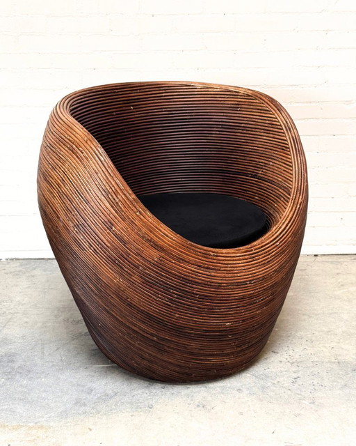Sillón de ratán orgánico atribuido a Gabriella Crespi