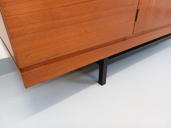Image 1 of Tall, modernist, vintage Scandinavian sideboard in teak and black metal from the 1960s