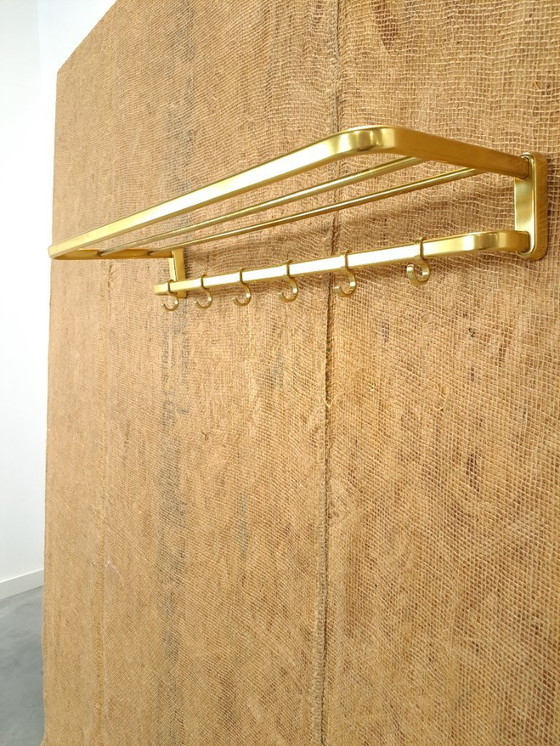 Image 1 of Porte-manteau en forme de train, couleur or, avec crochets, n° 18