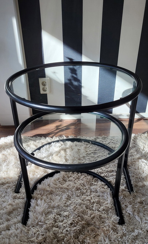 Post-Modern tubular frame nesting tables in black.
