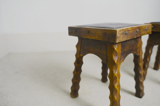 Image 1 of Rustic Oak Stools, 1940s French Hand-Carved Farmhouse Milking Stools, Fireplace Chalet Mountain Decor with Studded Leather Seats
