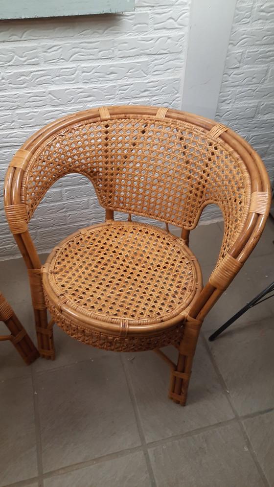 Image 1 of Set di 2 poltrone vintage in rattan con seduta e schienale intrecciati.